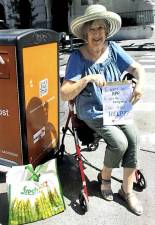 Elizabeth K. Rogers made a sign asking for help when she was not able to work the app needed to open a street compost bin near her apartment.