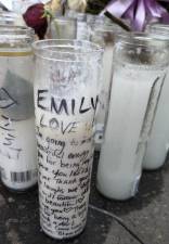 Memorial candles to Emily Ruiz, the fourth and latest victim of the July 4 horror crash at Corlears Hook Park. She was preceded in death by Lucille Pinkney, her son Herman, and Ana Morel.