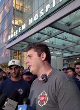 FDNY member Christopher Zambrzycki speaking to reporters after being discharged from Harlem Hospital. Zambrzycki was severely injured during a six-alarm fire on W. 145th St. on Nov. 1.