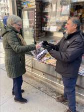 Sadik Topia<b>, </b>man of the people, bringing them the news from his old stand on the corner of W. 79th St. and Broadway.