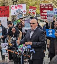 Michael Mulgrew, president of the United Federation of Teachers, at a rally outside City Hall on Nov. 17 blasted Mayor Eric Adams proposed budget cuts which will slash nearly $1 billion from the DOE over the next two years. Photo: Brian Berger