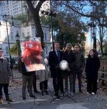 City Councilmember Erik Bottcher speaking at a press conference on a new bill that will further regulate newsracks.