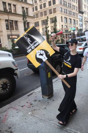 Juliana Marguiles walks the picket line for SGA-AFTRA on E. 19th St. recently outside the offices of Warner-Discovery and Netflix. Photo: Steve Sands