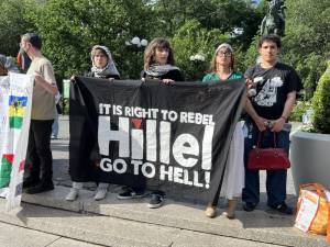 Protestors in Union Square hold banner “It Is Right To Rebel - Hillel Go To Hell”