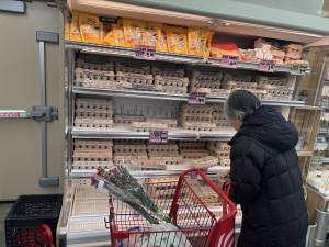 A shopper named Ginny at Trader Joe’s on Jan. 29 was picking up two cartons of eggs. She said on earlier visits the shelves were devoid of the organic eggs she buys.