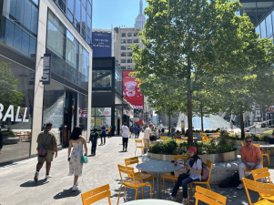 <b>Plaza33 features tables, chairs, and shade from trees to relax in the summer heat amid the bustle of Midtown. </b>