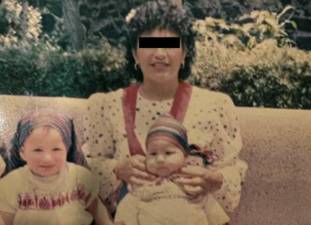 The woman who is the central character in “<i>The Cleaning Lady,” </i> holding two of her children before she left them to cross into the United States. She was gone for 15 years before returning home.