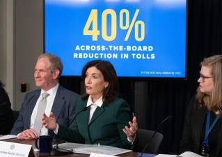 Governor Kathy Hochul (center) is flanked by MTA chairman Janno Leiber (left) and NYS director of operations Kathryn Garcia at the press conference unveiling the congestion pricing toll was being unpaused but at $9 peak price, a 40 percent cut from the original $15 toll.