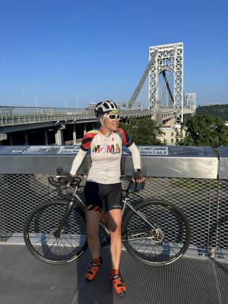 Bicyclist pauses at George Washington Bridge