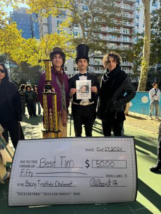 The winner of the Timothée Chalamet look-alike contest won $50, presented to him on a giant check.