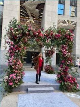 “Self love should be your first love,” says Helenice Valentin, who vamped for the roaming photographer hired by Rockefeller Center to take photo with individuals’ cell phones. Photo: Jill Brooke