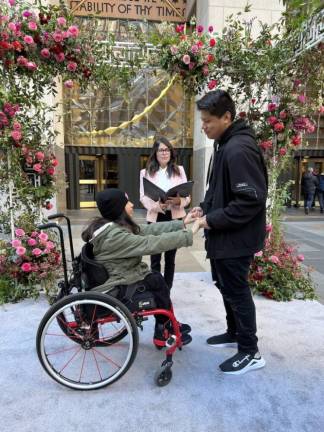 Michael Cruz and Giselle Acevedo renew vows the cheers of onlookers on St. Valentine’s Day in Rockefeller Plaza. Photo: Jill Brooke