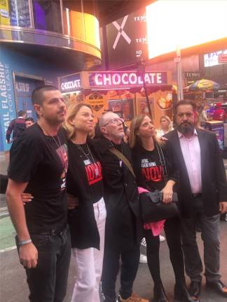 People stand with Thomas Hand (center) include Odelia Torteman (left of Hand) one of the co-creators of the Bring Them Home Now movement. Photo: Keith J. Kelly