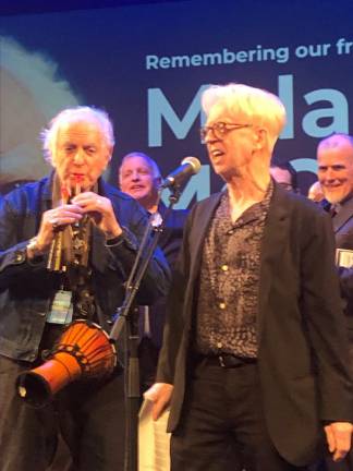 <b>Larry Kirwan, playwright behind Tony nominated “</b><i><b>Paradise Square”</b></i><b> and the longtime frontman of the Celtic rock band Black 47, belts out a farewell song to Malachy McCourt at Symphony Space on May 30. </b>Photo: Keith J. Kelly