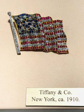 Early Tiffany and Co. ruby, sapphire, and diamond American flag brooch. American, ca. 1910.