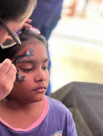 Face painting kept kids entertained at the Cricket T20 World Championship on June 29. Photo: Maksuda Aziz