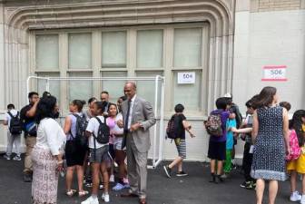 <b>New York City schools Chancellor David Banks, center, interacts with students on the last day of school on June 26, 2024 at P.S. 165, The Robert E. Simon School, in Manhattan. </b>