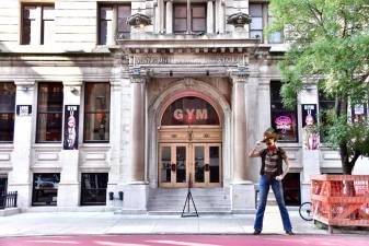 <b>Manhattan model Karen Rempel tips their hat to the Village People’s cowboy, Randy Jones, at the former YMCA that inspired the song. </b>