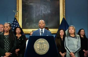 A glum faced Eric Adams, surrounded by equally glum faced aids such as the new first deputy commissioner Marie Torres-Springer (forefront to right of Adams in photo), at a press conference Nov. 6 to discuss the impact of the 2024 Presidential election on New York City.