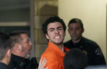 Suspect Luigi Mangione is taken into the Blair County Courthouse on Tuesday, Dec. 10, 2024, in Hollidaysburg, Pa.