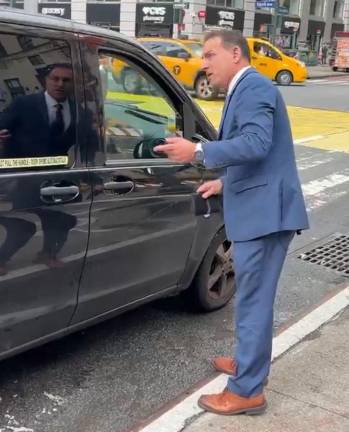 Crackdown Day 1: MTA Senior Vice President Frank Annicaro, NYC’s bus czar, took the task of informing a van driver that he could not discharge passengers in the bus lanes on the first day of a crackdown on Aug. 19. By that point, the M34 SBS bus behind him had already taken images that will be sent out, with a ticket within two weeks of the violation.