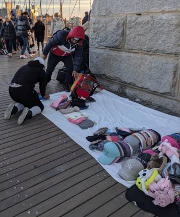 Dozens of Illegal Vendors— &amp; One Giant Ape—Reclaim Brooklyn Bridge from City