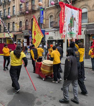 The drums roll down Bayard Street.