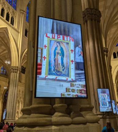 Lupita! Or, rather, many Lupitas as seen on the cathedral’s many video screens which bring the pulpit closer to the people in distant pews.