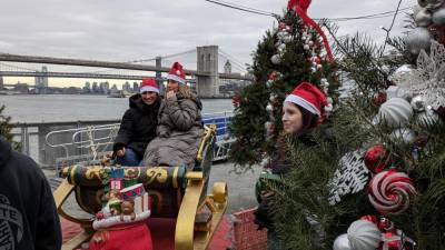 Photo op sleigh with the Brooklyn Bridge as a backdrop at the Winter Wonderland at Pier 15, Sunday Dec. 15.