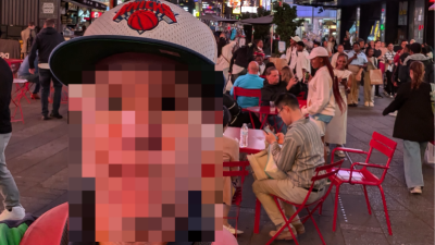 A typical Times Square tourist, October 2024. Their face has been blurred to preserve their anonymity.