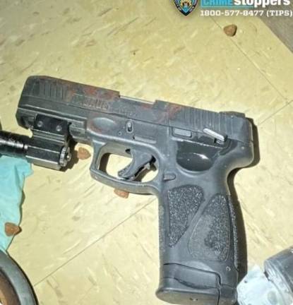 Photo of a gun that cops said was recovered at the scene.