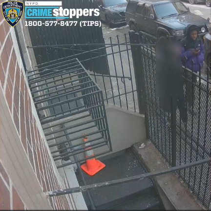 A woman is soon to be forcibly touched by a male pretending to look at his phone in front of 182-184 E. 2nd Street, Jan 22, 2025.