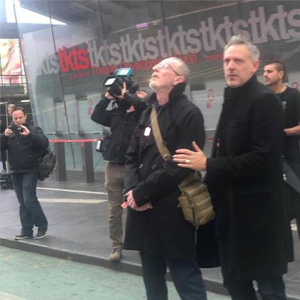 Grief stricken father Thomas Hand (left) gazes up at Times Square billboard featuring photos of his daughter Emily playing in Israel before she was taken hostage on Oct. 7. She turned nine years old on Nov. 17. Rob Anders (right) one of the co-founders of the Bring Them Home Now campaign comforts Hand. Photo: Keith J. Kelly