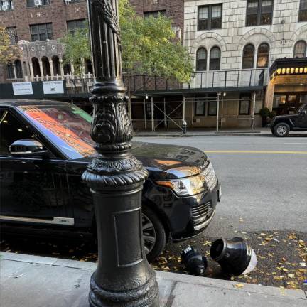 A streetlamp fixture fell on a car near 40 W. 72nd St. on Nov. 30, the owner of the vehicle said. An Upper West Sider that lives on the street, he took pictures of the aftermath.