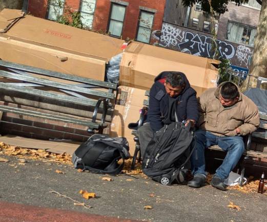 The east side of Sarah D. Roosevelt Park, facing Chrystie Street. Note cardboard shelter and morning beer bottle.