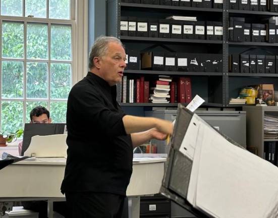 Kent Tritle, director of cathedral music and one of America’s leading choral conductors, chimes in with notes and suggestions that the singers jot down on their music sheets. Photo: Carrene Gepilano