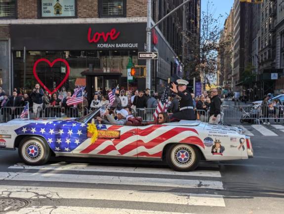 We the people love America, love cars and love our troops. The Plymouth Fury near the head of the parade transported US Marine Dakota Meyer, the grand marshal of this year’s parade and medal of honor winner who served in Iraq.