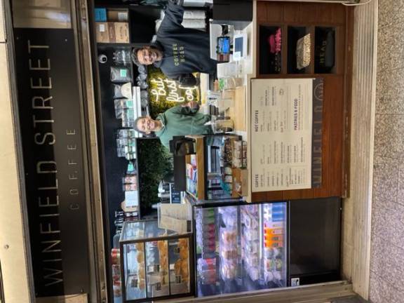 Baristas behind the counter at the Winfield Street Coffee shop in the Q train station offer a special blend of Brazilain coffee to customers. Photo: Zachary Web