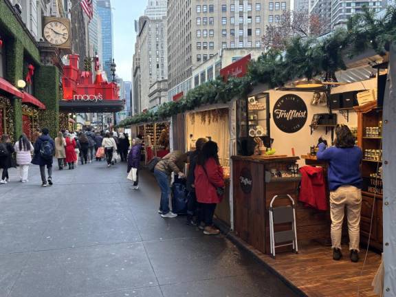 Fortnately, firefighters managed to extinguish the blaze in the Herald Holiday Market before it leaped W. 35th St. The market area in front of Macy’s was open for business on Dec. 17.