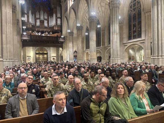 A full house turned out for the annual St. Patrick’s Cathedral pre-parade mass, including members of the Fighting 69th Regiment (in fatigues) and leaders of the Gaelic Athletic Association, joining grand marshall Michael Benn.