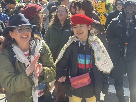 Elizabeth Payne (left) said he came to the anti-Musk rally because she did not want her daughter to one day ask her why she did not stand up for democracy. Her daughter, Avery Tsai was there too and said, “I’m here to stand against fascism.”