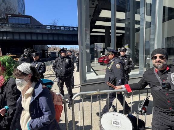 Police set up a barricade around the Tesla showroom on Washinton St. in the Meatpacking District, but that did not prevent at a half dozen protestors from entering the showroom and getting arrested as the largely peaceful crowd was breaking up after a two hour rally,