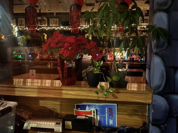 A few stray poinsettias can be seen inside the Abbey Tavern, which closed its doors for the last time on Jan. 20, ending a 60-plus-year run in Kips Bay.