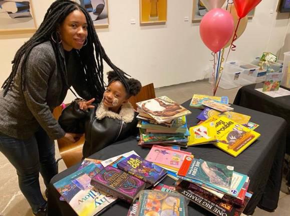 Parents and children enjoying 2023’s Free Children’s Book Fair event on the Upper West Side. It’s returning to the Marlene Meyerson JCC, located on Amsterdam Ave., on Jan. 26.