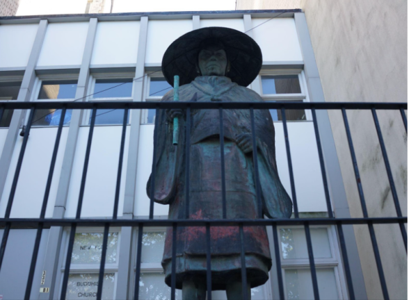 The Shinran statue outside of the New York Buddhist Church, 331 Riverside Drive survived the atomic bomb dropped by the USA on Hiroshima during WWII. It sea-green bronze exterior is streaked with red created from radioactive atomic bomb drop burns.