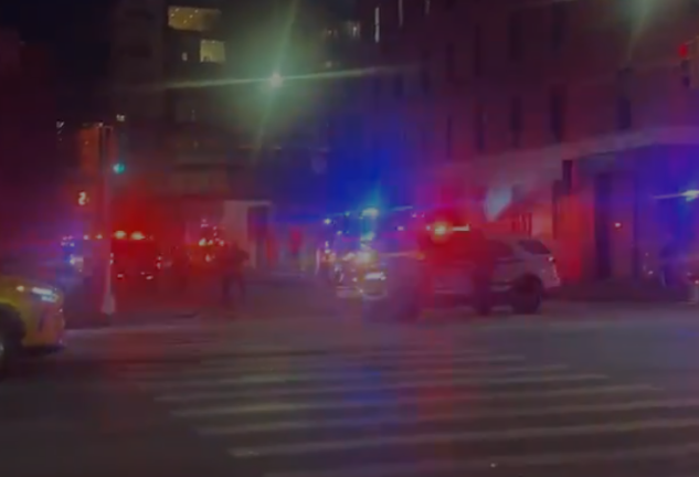 Firefighters and police cruisers responding to a blaze at 520 W. 27th St., a mixed-use luxury condo building, on Jan. 26.