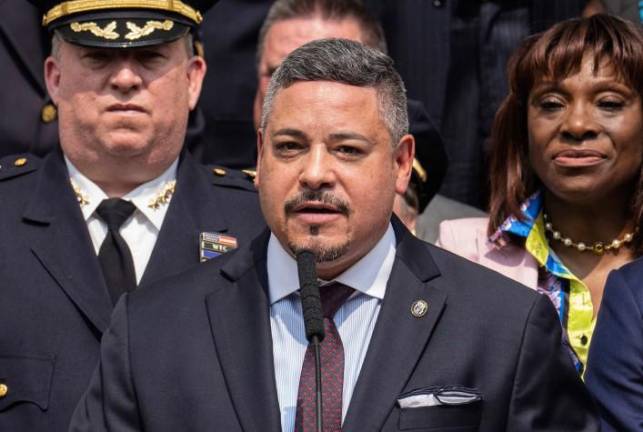 Former Police Commissioner Ed Caban, who resigned Sept. 12, about a week after federal investigators raided his home and seized his phone. To his right is first deputy mayor, Sheena Wright who is the fiancé of David Banks, who said on Sept. 24 that he was resigning as education chancellor.