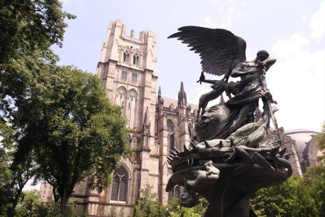 The Peace Fountain Chimera located at 1047 Amsterdam Avenue with the Saint John the Divine Cathedral in the back. Photo: Beau Matic.