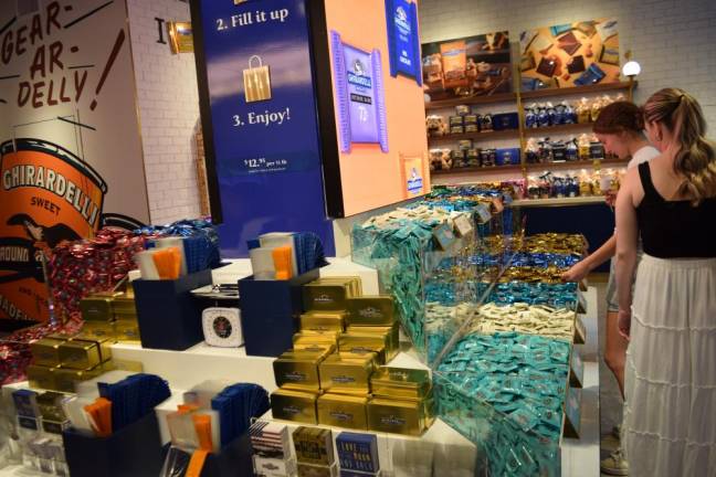 Ghirardelli sells a wide variety of individually wrapped chocolate squares at the New York City store.