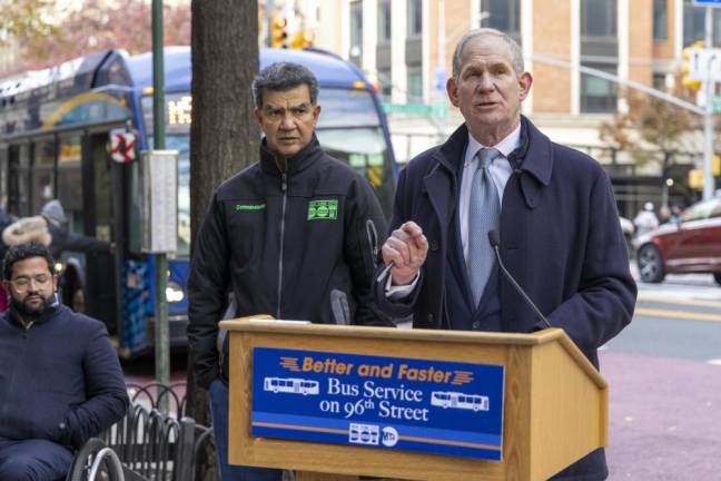 MTA Chief Janno Lieber (at podium) and NYC DOT Commissioner Ydannis Rodriguez (left, green logo) announce the completion of a bus lane overhaul project for 96th St.